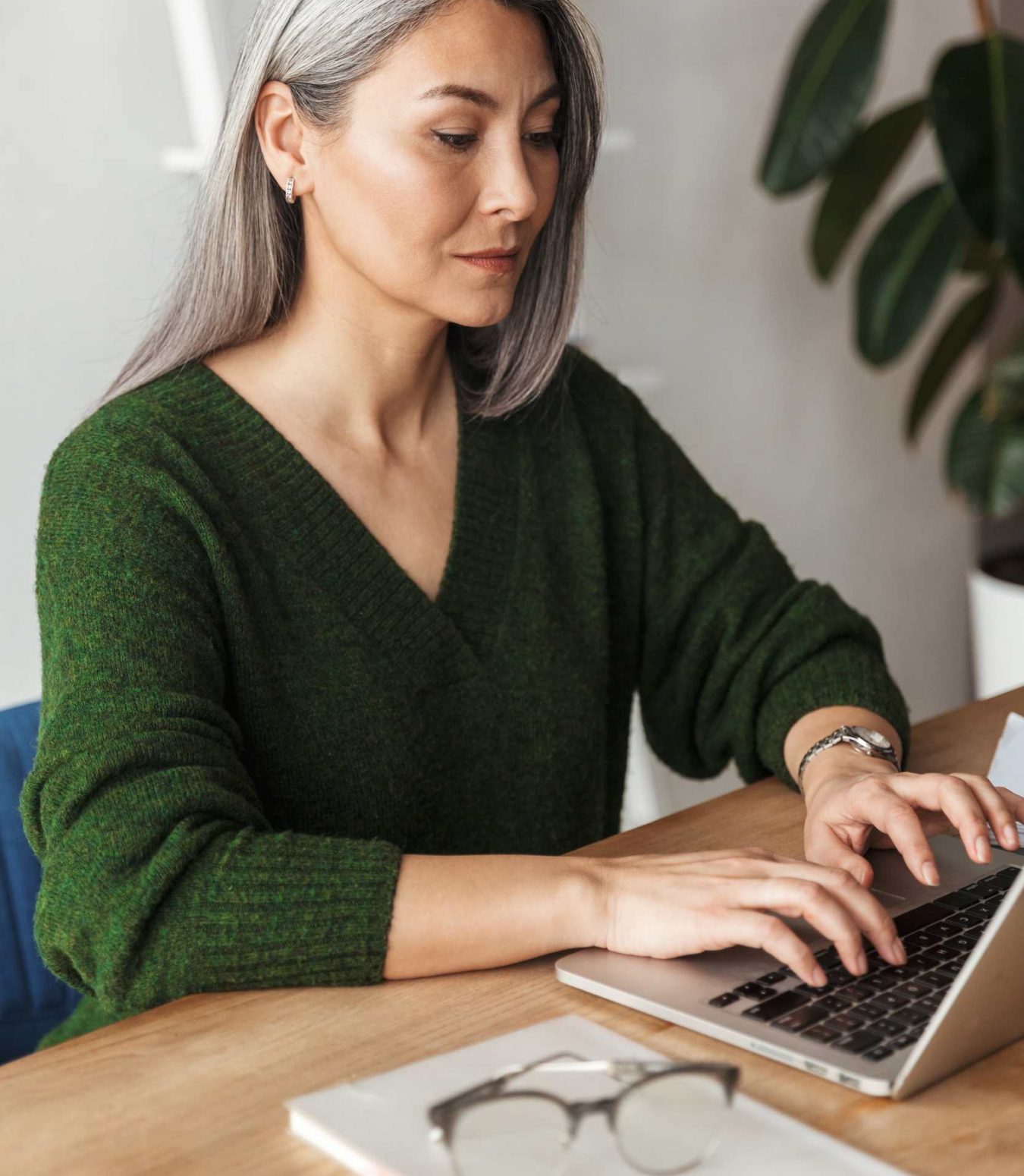 photo-of-gray-haired-focused-businesswoman-typing-MJKPXEZ.jpg